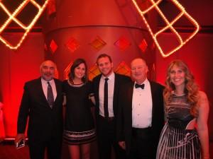 Mike Flores, Sarah Bobbe, Drew Jenkins and Adrienne Wiggins congratulate Roger A. Soape, the incoming AAPL President, at the Moulin Rouge President’s Ball. 