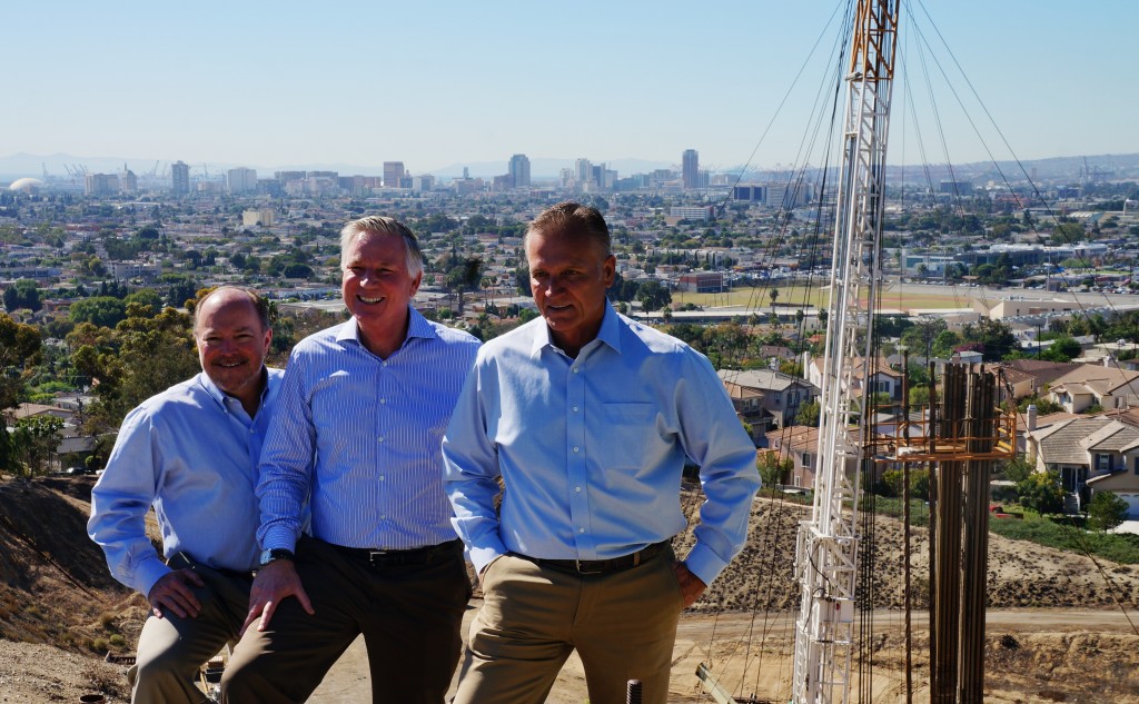 Pictured near one of their drilling sites with Signal Hill Petroleum President and CEO Craig Barto, center, are David Slater, left, the firm’s executive vice president and chief operating officer, and Kevin Laney, vice president of rig operations for the company. (Photograph by the Business Journal’s Thomas McConville)